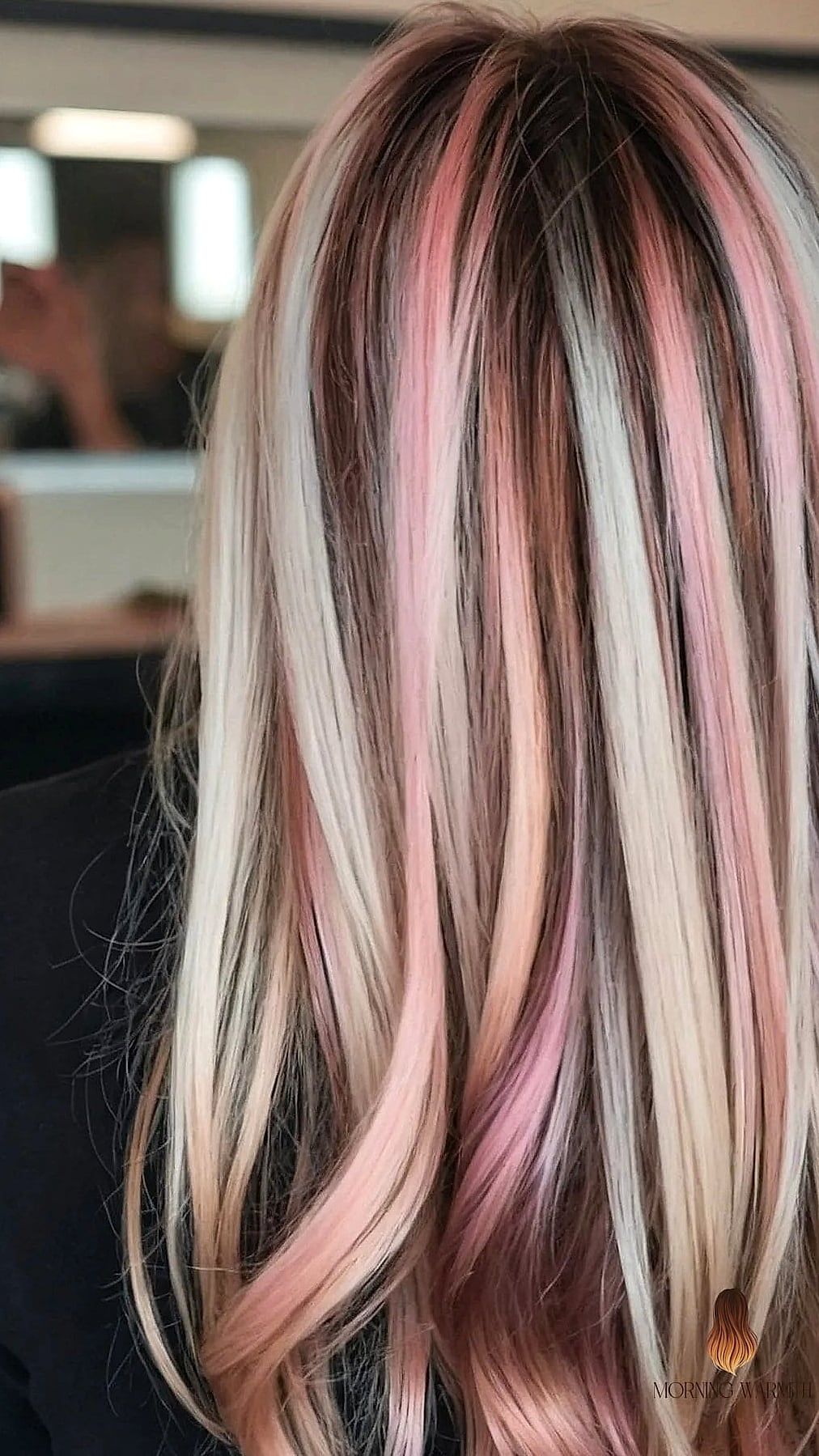 Chic Layered Cut with Subtle Pink Highlights