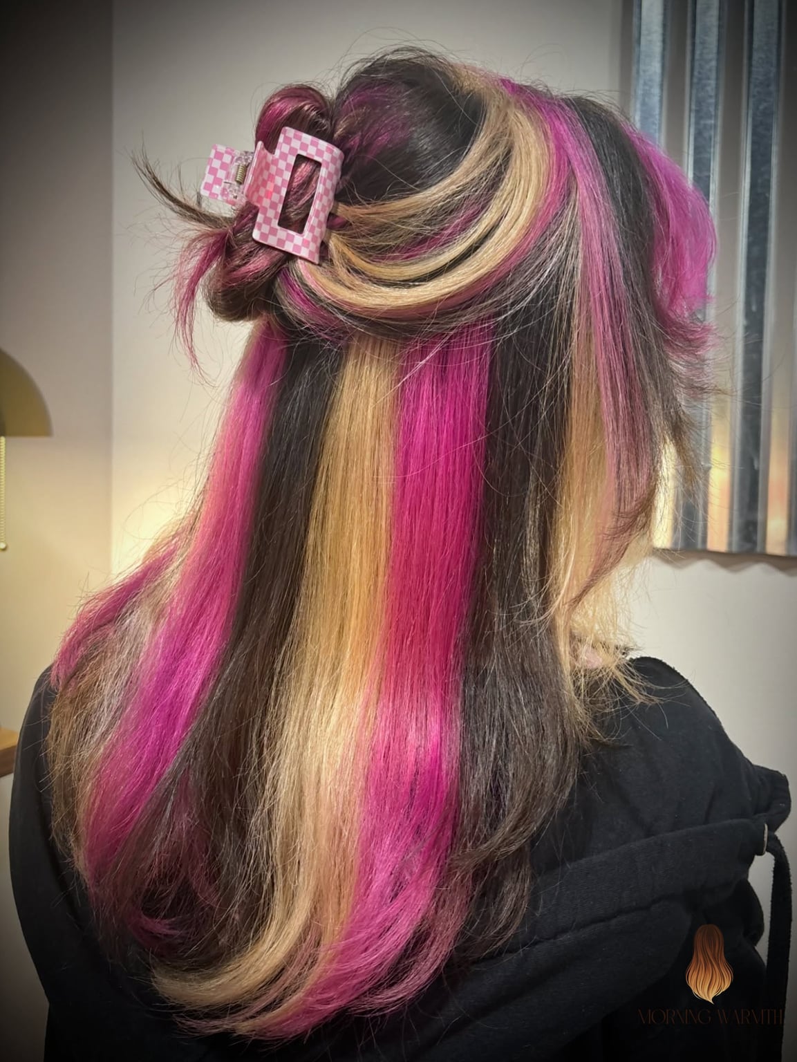 Dynamic Pink and Blonde Streaked Layers with Playful Texture