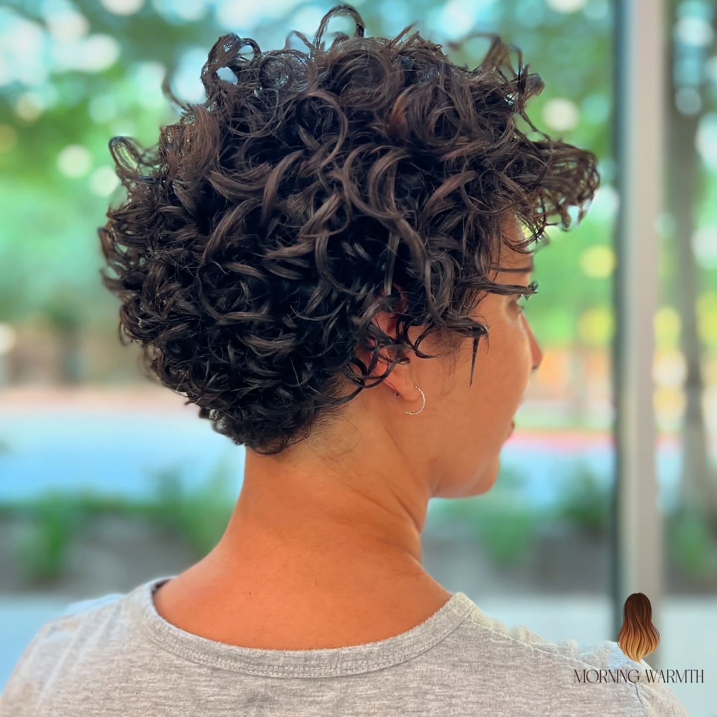 Modern Curly Pixie with a Tapered Back