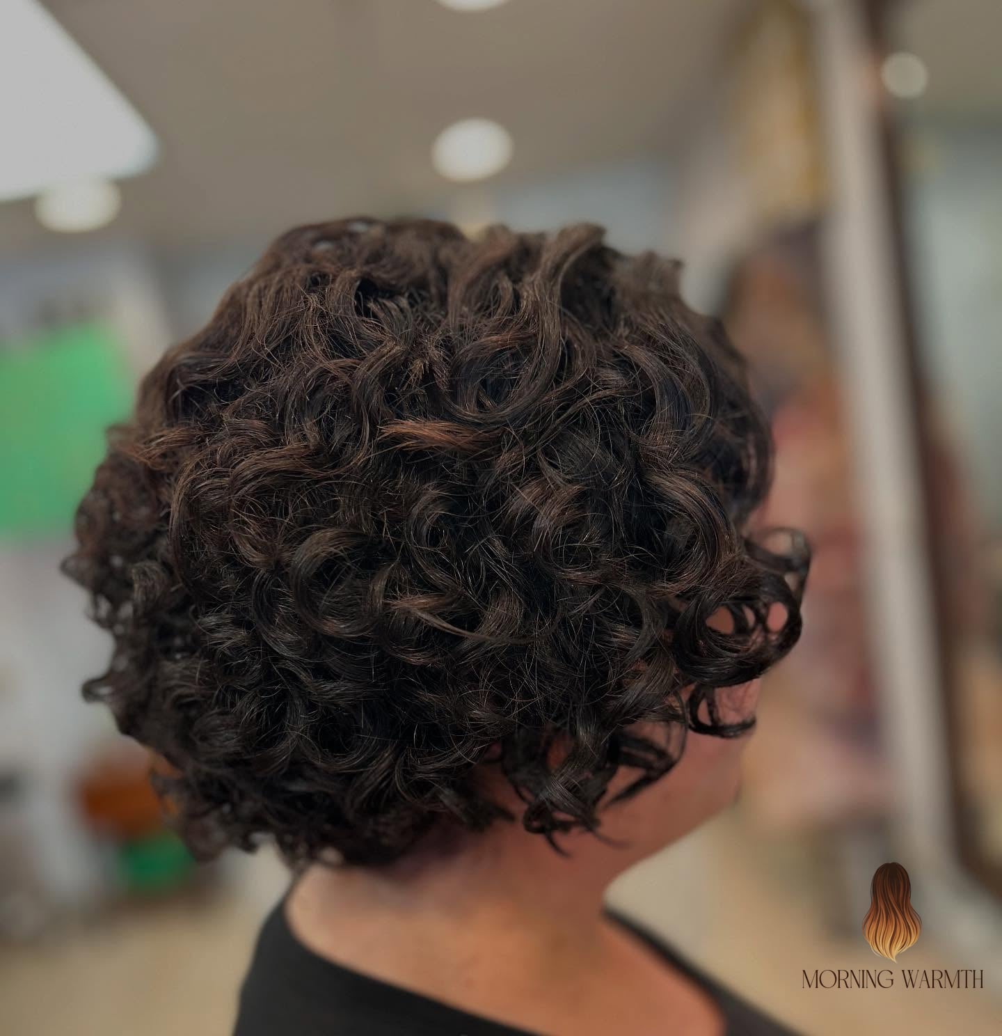 Textured Bob with Tight Curls and Subtle Highlights