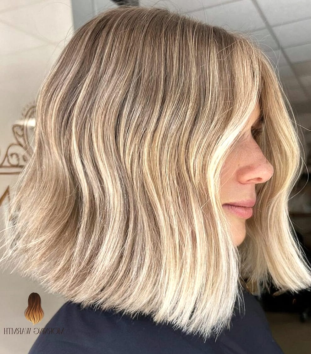 28 Balayage Blonde Looks You'll Want to Screenshot Immediately 27 Warm Blonde Layered Bob with Soft Bangs